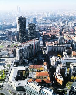 Aerial view of cityscape against sky