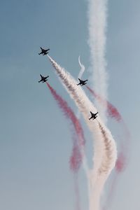 Low angle view of airplane flying in sky