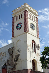 Low angle view of bell tower against sky