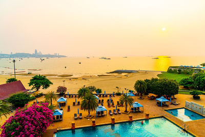 High angle view of swimming pool by sea against sky