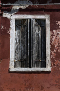 Closed window of old building