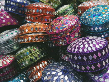Full frame shot of colorful caps for sale in market