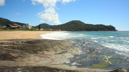 View of calm beach against the sky