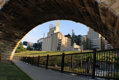 Buildings seen through arch bridge