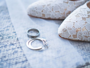 High angle view of wedding rings on table