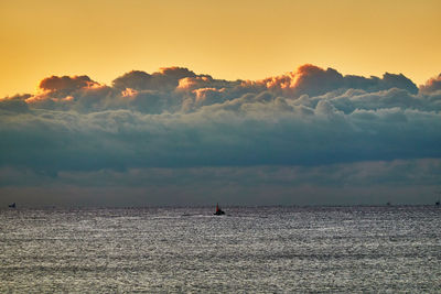 Scenic view of sea against sky during sunrise