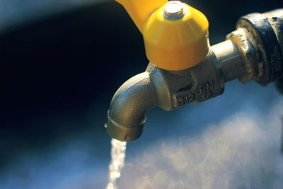 Close-up of water running from faucet