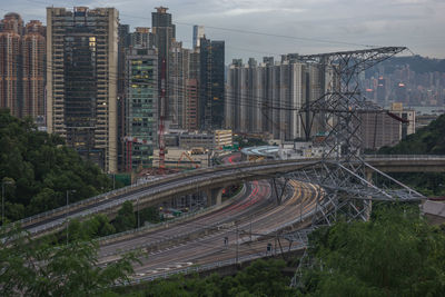 Aerial view of skyscrapers in city against sky