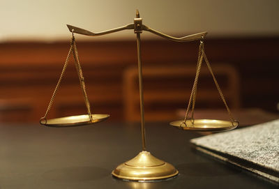 Close-up of clock on table