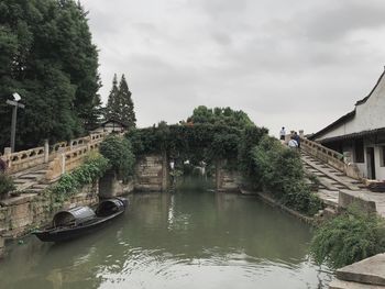 Panoramic view of river amidst trees against sky