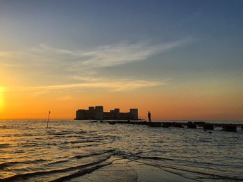 Scenic view of sea at sunset