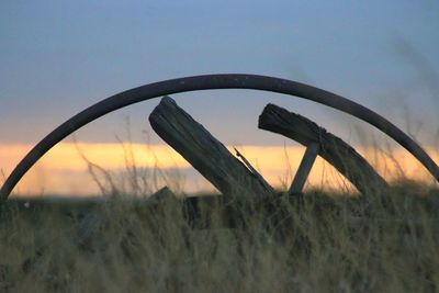 Close-up of metal structure against sky