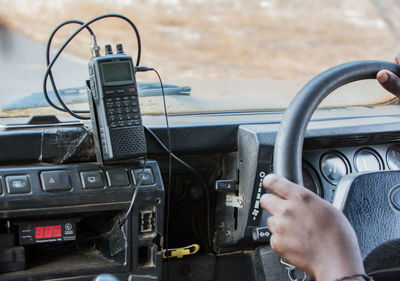 Cropped image of person driving vehicle