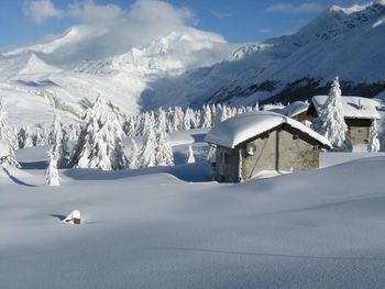 Scenic view of snowcapped mountains against sky