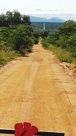 Dirt road passing through landscape