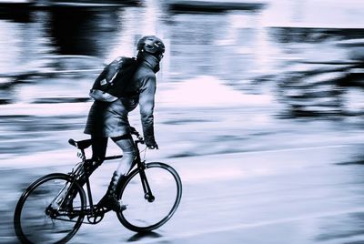 People riding bicycle on road