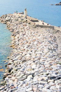 Stones of a pier of the touristic harbor in camogli, liguria, italy