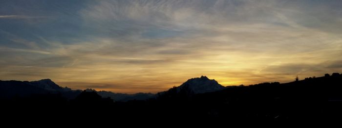 Scenic view of mountains at sunset