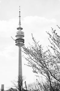 Low angle view of tower against cloudy sky