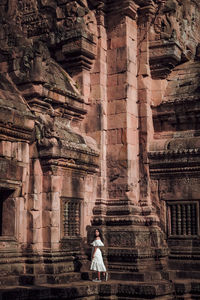 Full length of man outside temple against building