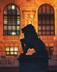 Statue of dog on window of building