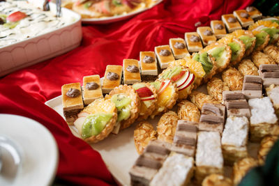 Photo of a variety of small cakes on the buffet