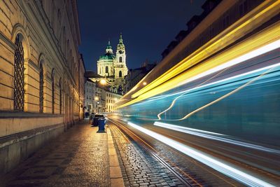 Light trails on illuminated city at night