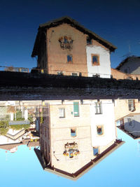 Exterior of house against clear blue sky