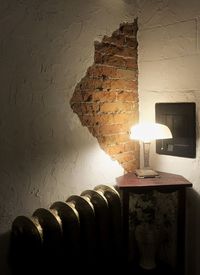 Close-up of illuminated lamp on wall