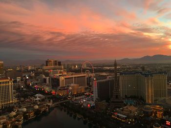 High angle view of buildings against cloudy sky during sunset