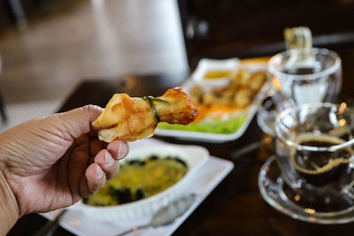 Close-up of hand snack holding 