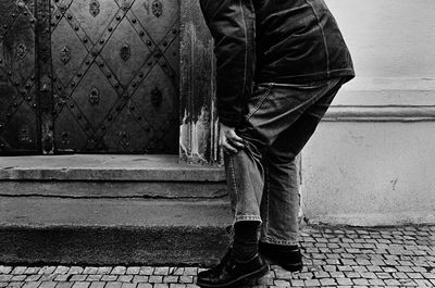 Low section of man standing on floor