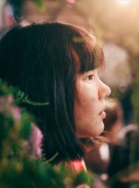 Close-up of woman looking away outdoors