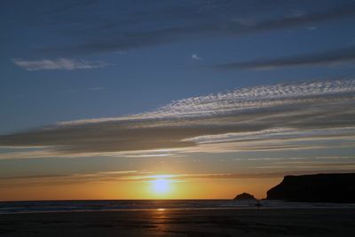 Scenic view of sea against sky at sunset