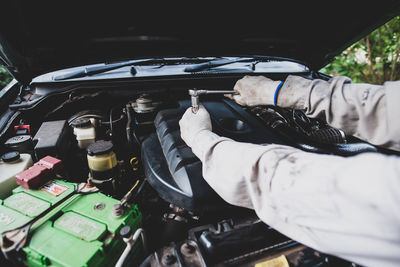 Low section of man holding car