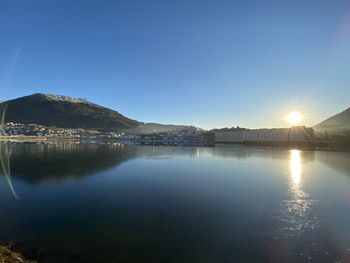 Scenic view of lake against clear blue sky in bergen in front of ulriken