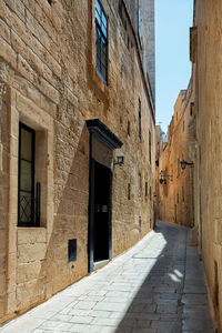 Footpath amidst old building - malta mdina