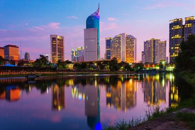 Reflection of illuminated buildings in water