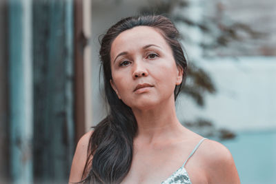 Portrait of woman standing outdoors