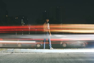 Blurred motion of light trails on road at night