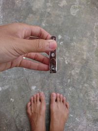 Close-up of person holding nail clipper