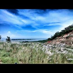 Scenic view of sea against cloudy sky