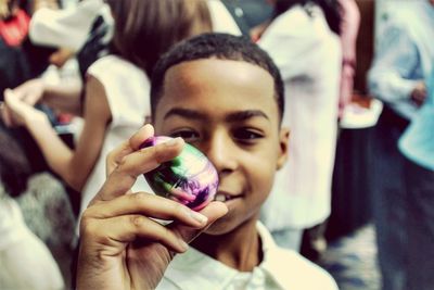 Close-up of boy holding easter egg