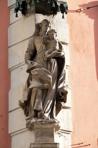 Low angle view of statue against building