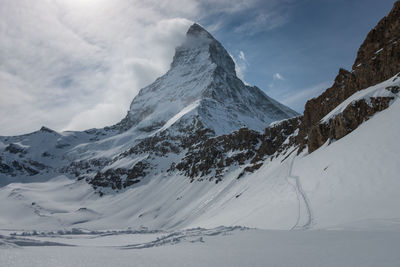 Scenic view of snowcapped matterhorn mountain against sky