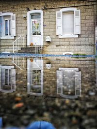 Reflection of house on window