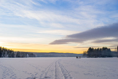 Scenic view of landscape against sky during winter