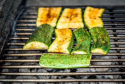 High angle view of meat on barbecue grill