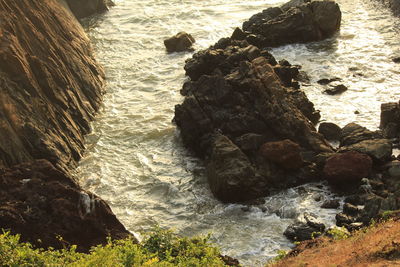 High angle view of rocks in sea