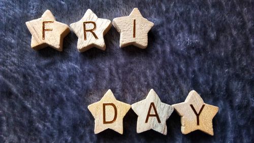 Close-up of text on star shape wood